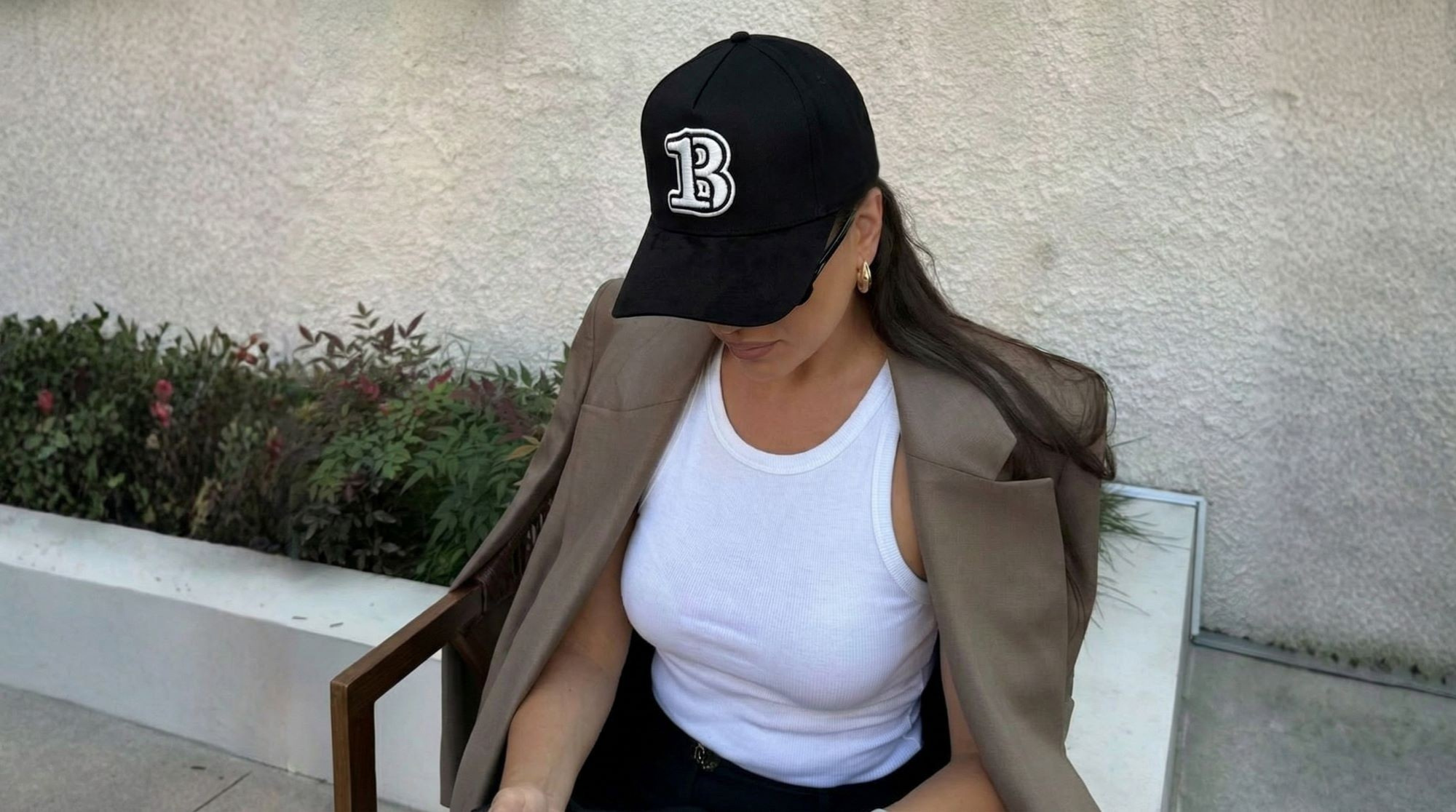 Girl with Black Hat sitting on the chair